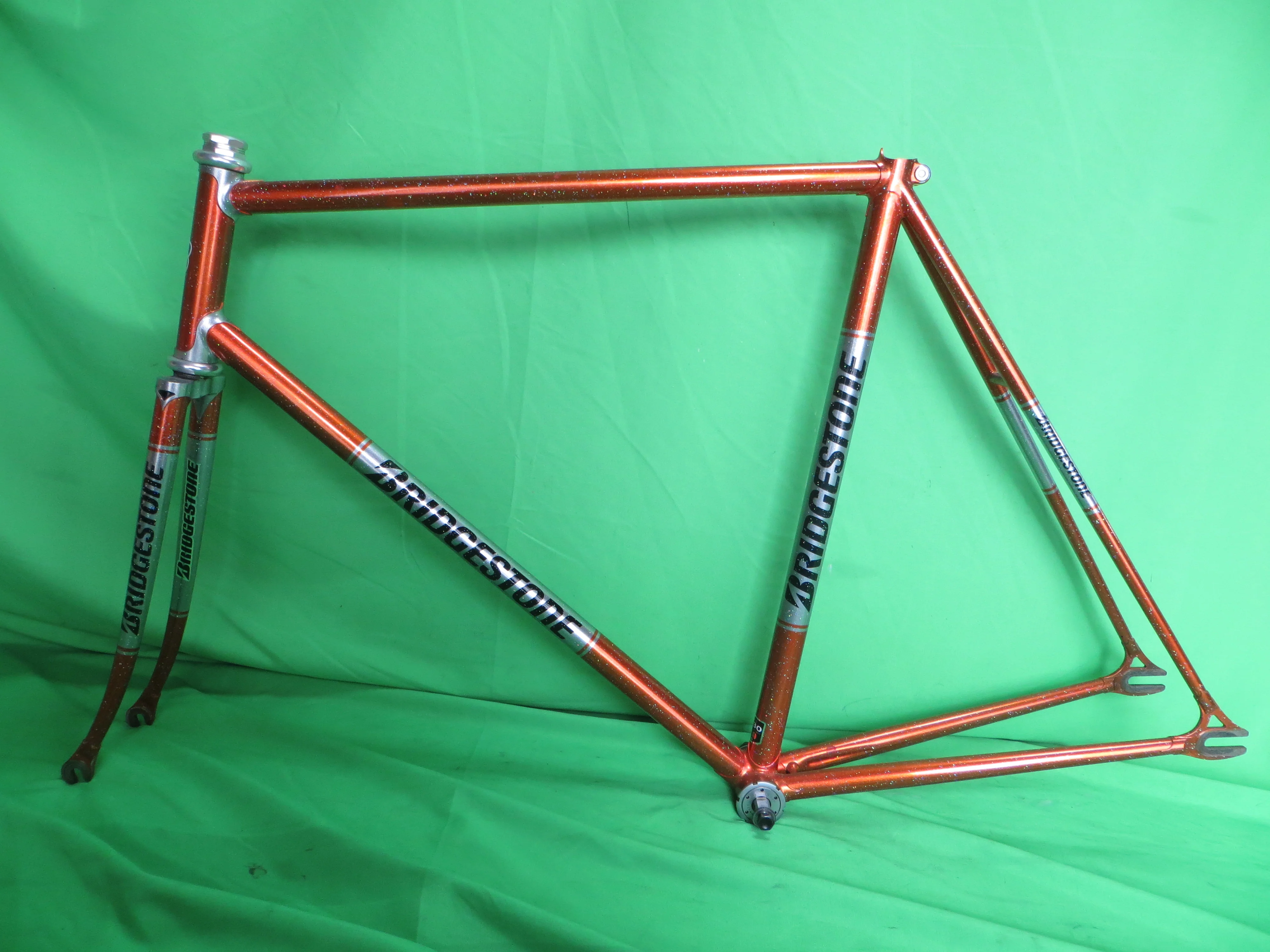 Bridgestone // Metallic Orange / Mach Silver with Rainbow Flake // 56.5cm
